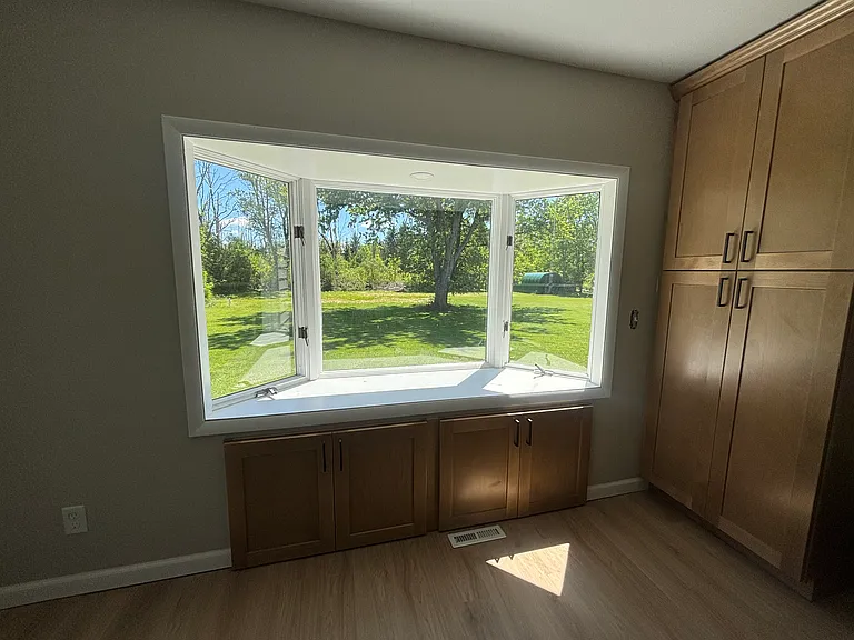 Picturesque window with a view of the private wooded lot