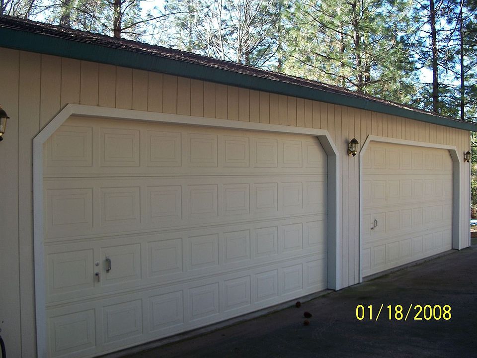Separate 4 car garage with workshop in addition to 2 car attached garage. 