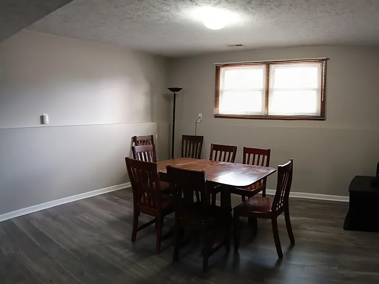 Basement family room with room to play games.