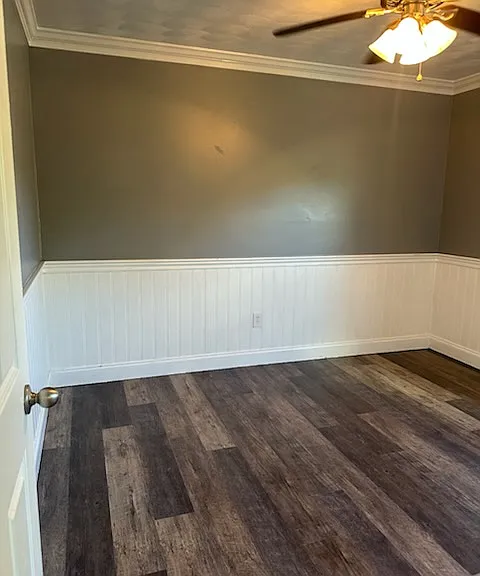 Bedroom #2 custom wainscoting and moldings view from hallway