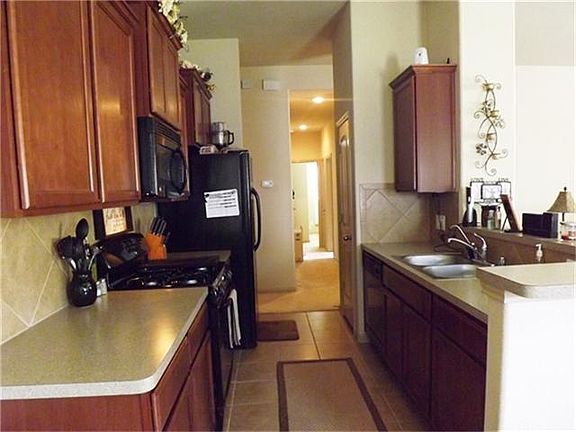 Galley style kitchen with view from breakfast area