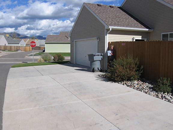 Large Parking Area & Attached Heated Garage