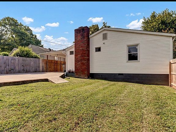 privately fenced backyard looking toward the rear of the house, handicapped accessible back yard