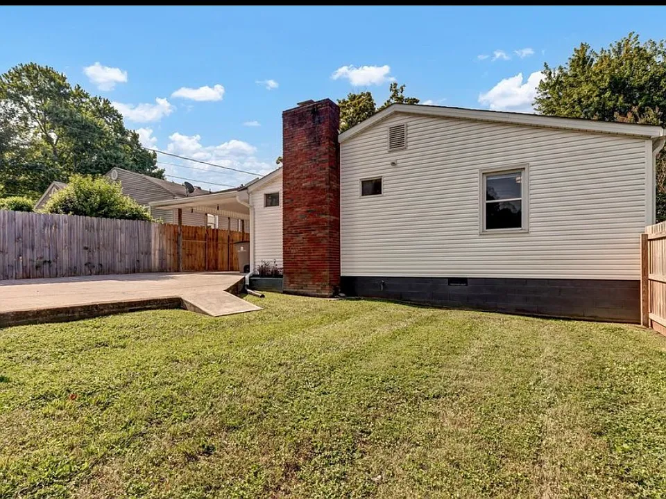 privately fenced backyard looking toward the rear of the house, handicapped accessible back yard