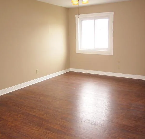 Spacious Living Room with hardwood floors