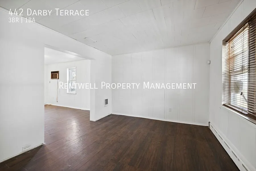 Updated 3-Bedroom End-Unit Home with Covered Porch & Patio — Photo 3