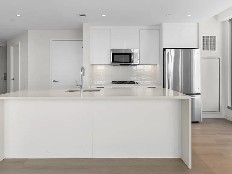 Kitchen with Breakfast Bar and Stainless Steel Appliances