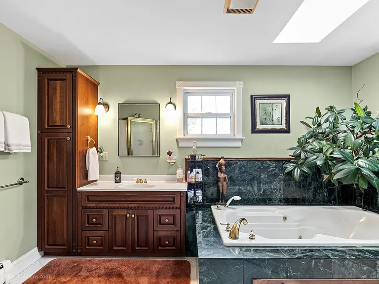 Ensuite off of primary bedroom. Soaker tub and stand up shower.