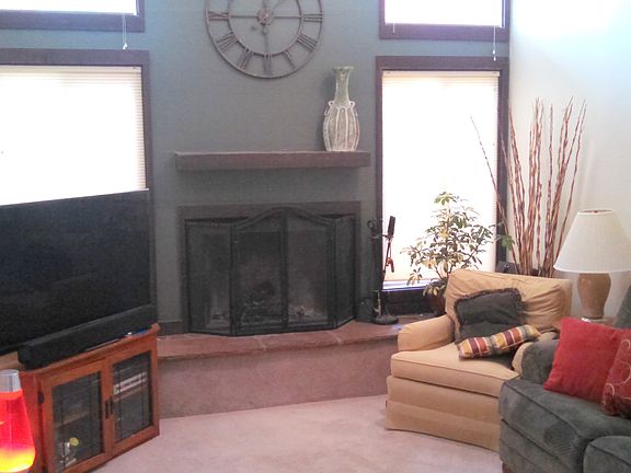 Living room with wood burning fireplace
