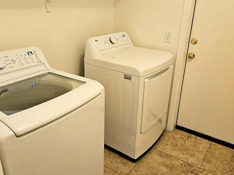 Another view of the laundry room with a NEW washer and dryer
