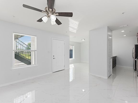 Downstairs no balcony, view of kitchen, pantry and dining area.