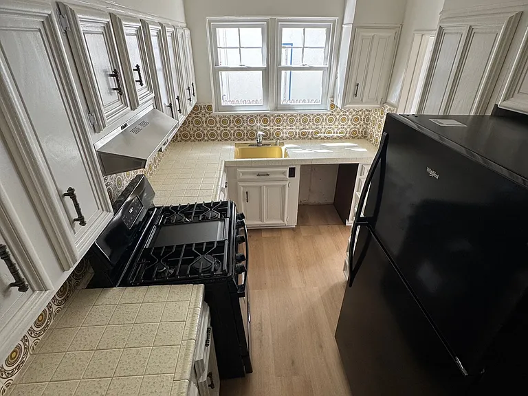 Kitchen (overhead) - updated kitchen with new range/oven, refrigerator, and ample cabinet storage.