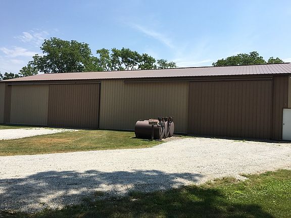 outside pole barn with fuel tanks