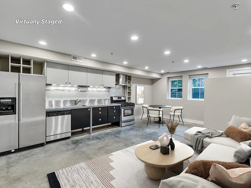 Living area, kitchen, dining area with furniture.