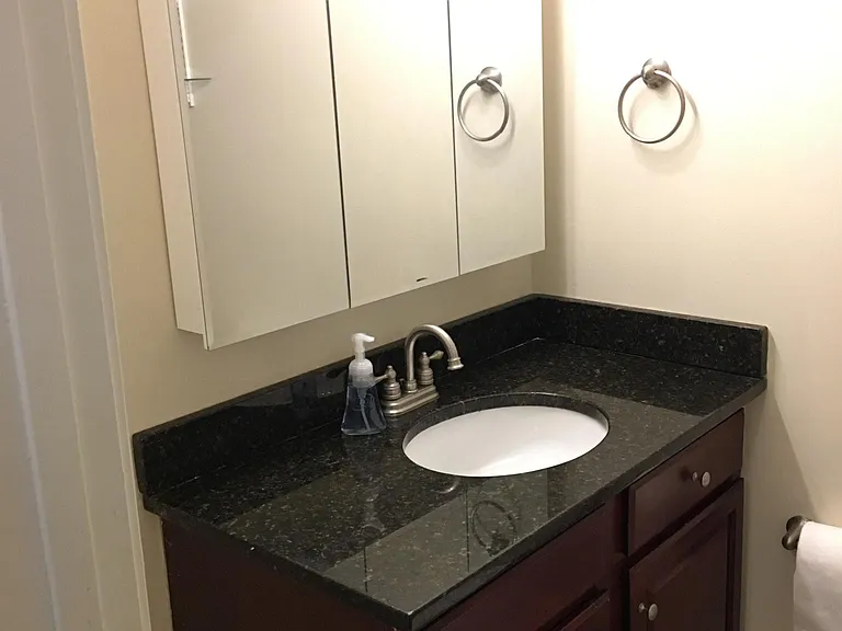 Granite and Cherry bathroom cabinet
