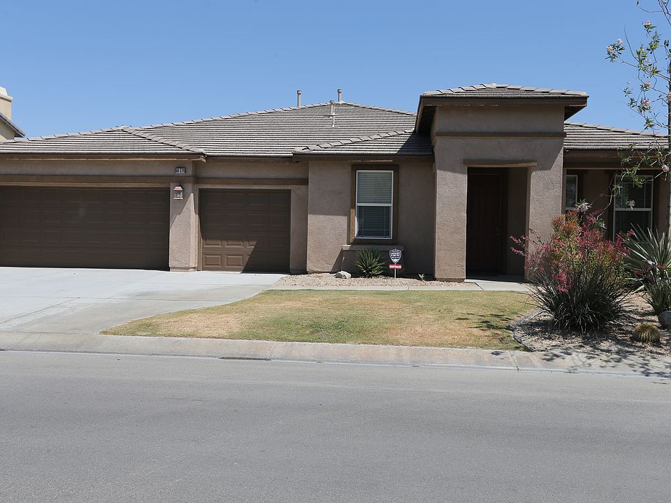 clean & nicely landscaped front yard