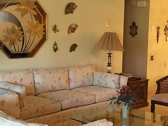 Senior (age 55+ only) community. short Term Furnished. Part of living room. Additional seating (chair and recliner, flat screen, dvd player, cd, radio, turntable not shown).