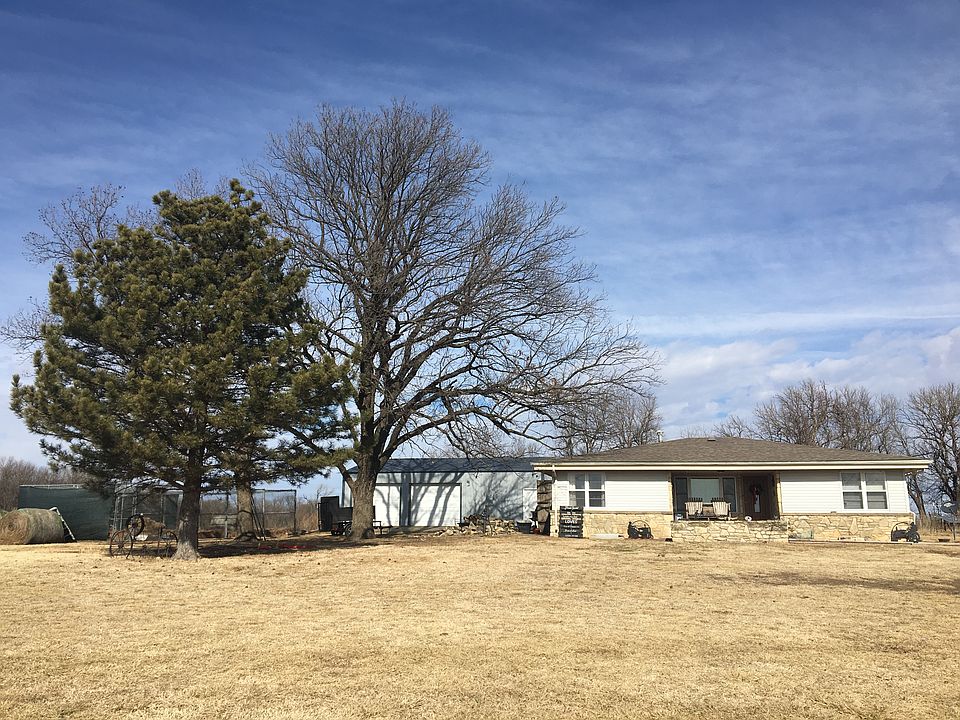 Shop on left front of house 