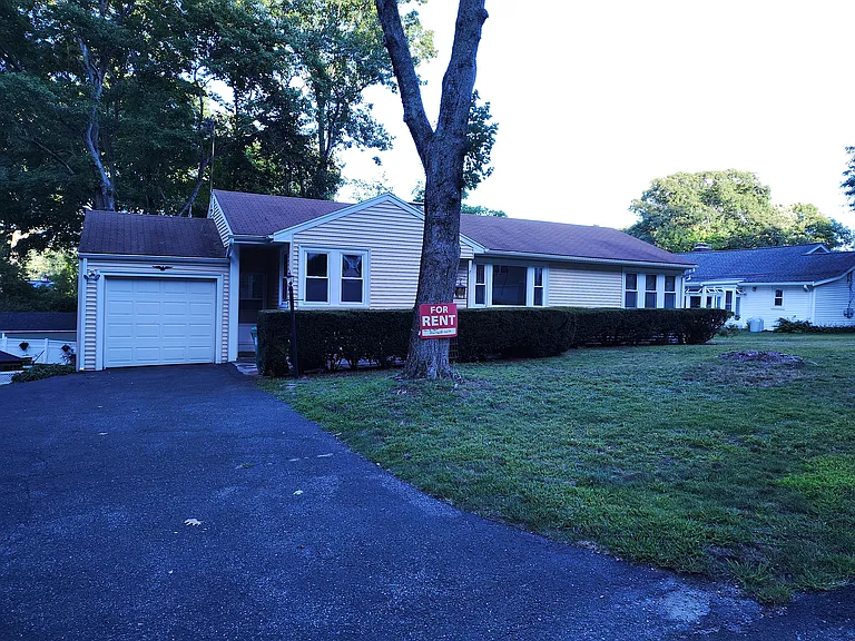 Front of house showing 1 car garage with automatic opener