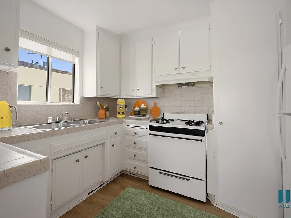 Kitchen with Stove, Refrigerator, and Ample Cabinet Storage