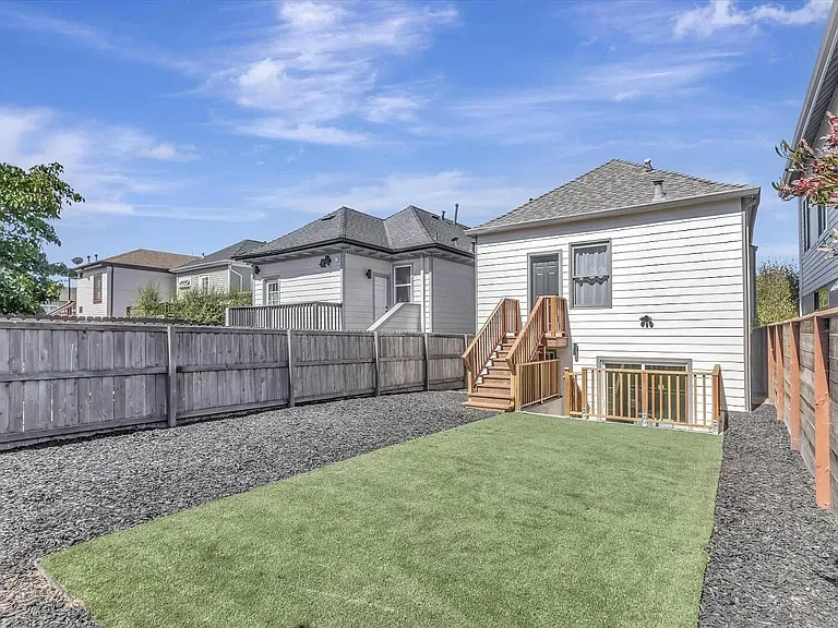 Backyard shared with upstairs tenants.