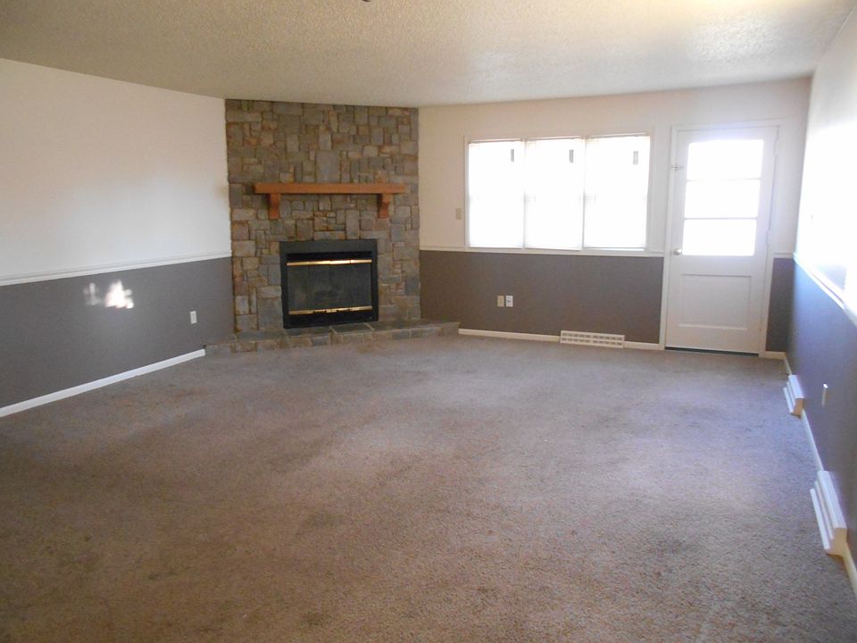 Wood burning stone fireplace in livingroom