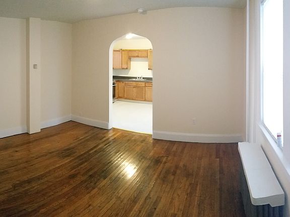 LIVING ROOM WITH VIEW OF KITCHEN