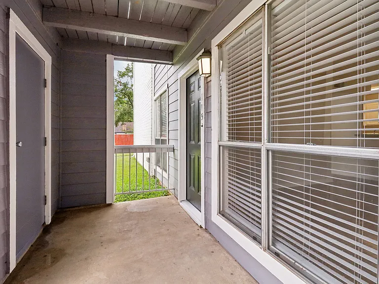 Inviting apartment entrance with large windows and natural light, overlooking a serene outdoor area. Inviting apartment entrance with large windows and natural light, overlooking a serene outdoor area.
