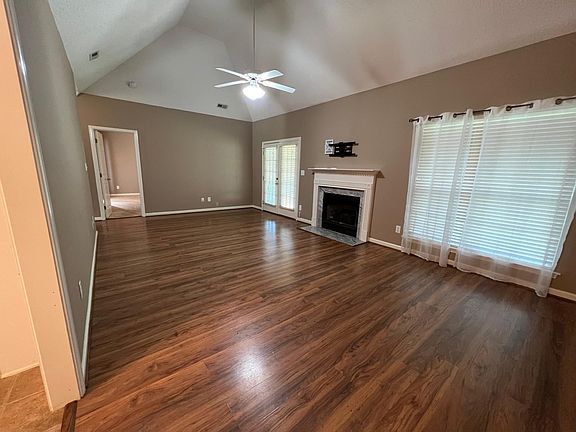 Living room with hardwoods and fireplace.