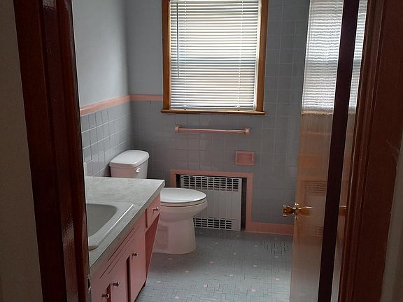 bathroom with a tube