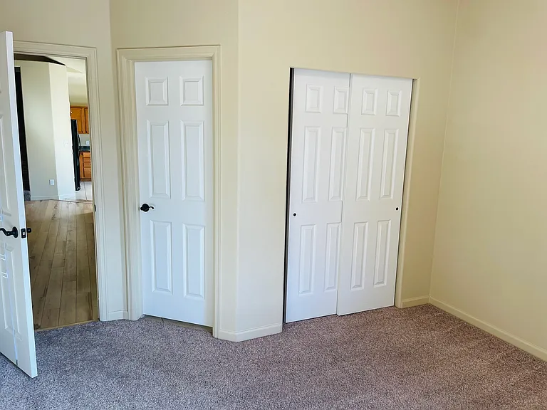 Guest bedroom with door to bathroom