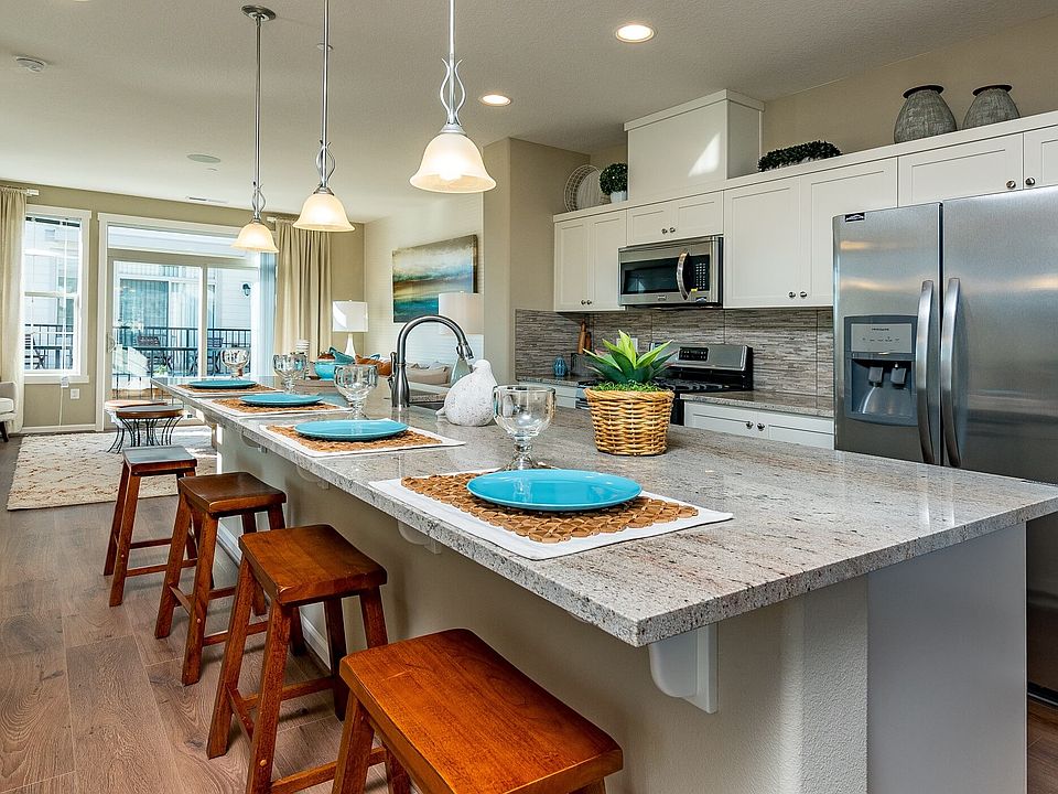 Kitchen towards living/patio (staged)