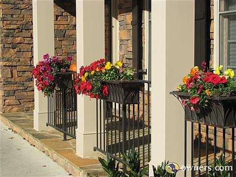 Front porch cutom copper planters wrought iron railing