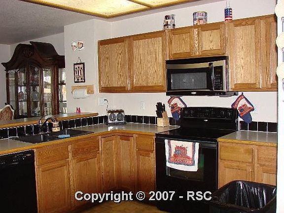 Kitchen with upgraded cabinets and newer appliances