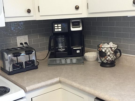 Kitchen with glass subway tile backsplash