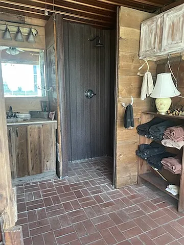 The bathroom and hunting camouflage paneling in the shower at the Lodge