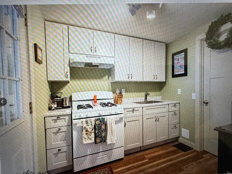 Complete kitchen with full sized refrigerator. No dishwasher. Wood floors.
