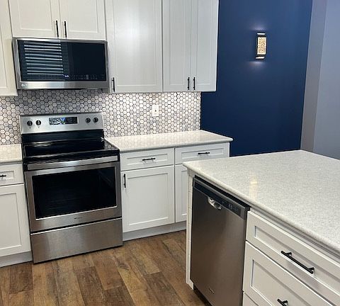 Stainless Steel Microwave, Self-Cleaning Range and Dishwasher