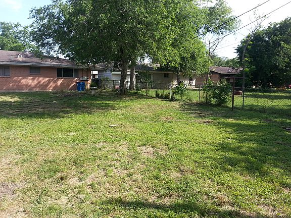 brick house with fenceline