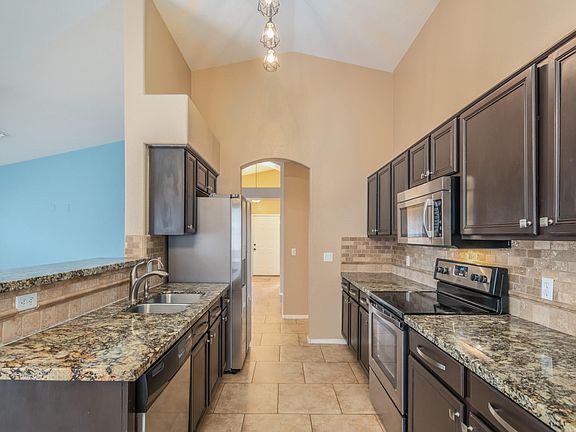 Granite Countertops and stone backsplash