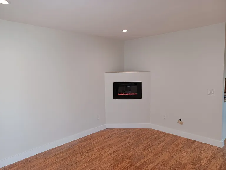 1st Level - Living Room/Area: Electric fireplace and recessed lights