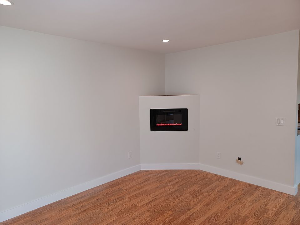 1st Level - Living Room/Area: Electric fireplace and recessed lights