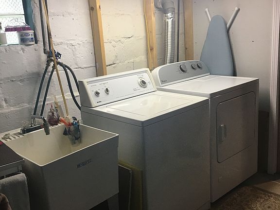 Laundry. New water heater (14) and wash sink.