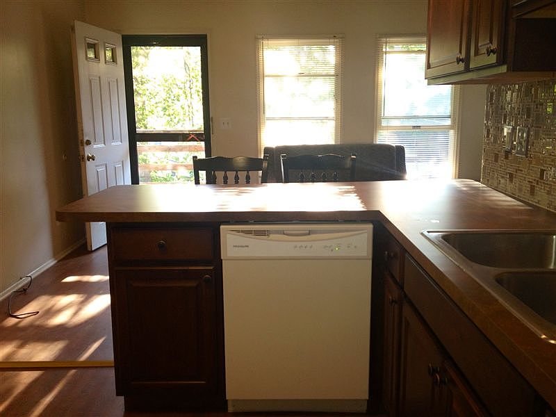 Kitchen showing breakfast bar