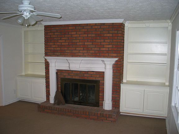 Classic Fireplace with Bookcases in Family Room