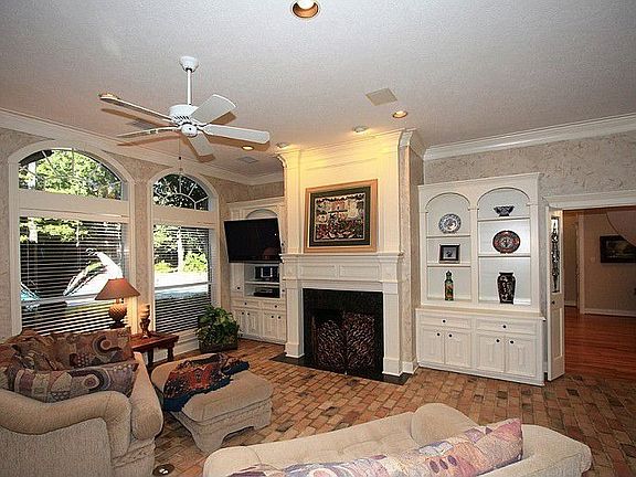 Family Room w/sep. fireplace, tons of built-ins, easy to care for brick floors