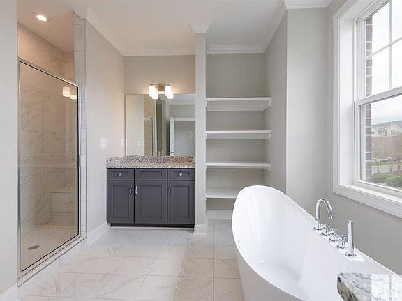 Master bathroom with step-in shower and separate tub