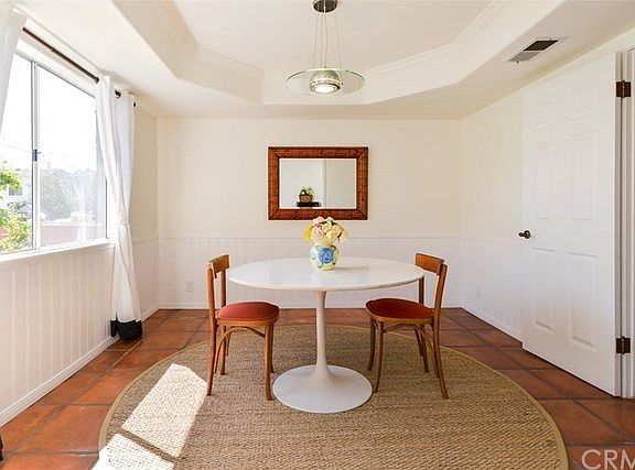 Just to the left of the entry is a formal dining room with great architectural detail in the ceiling.  The kitchen is off to the right.