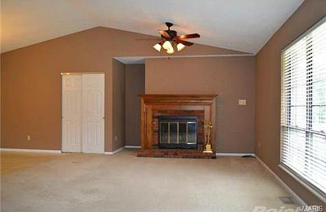 Great room with wood burning fireplace and electric blower!