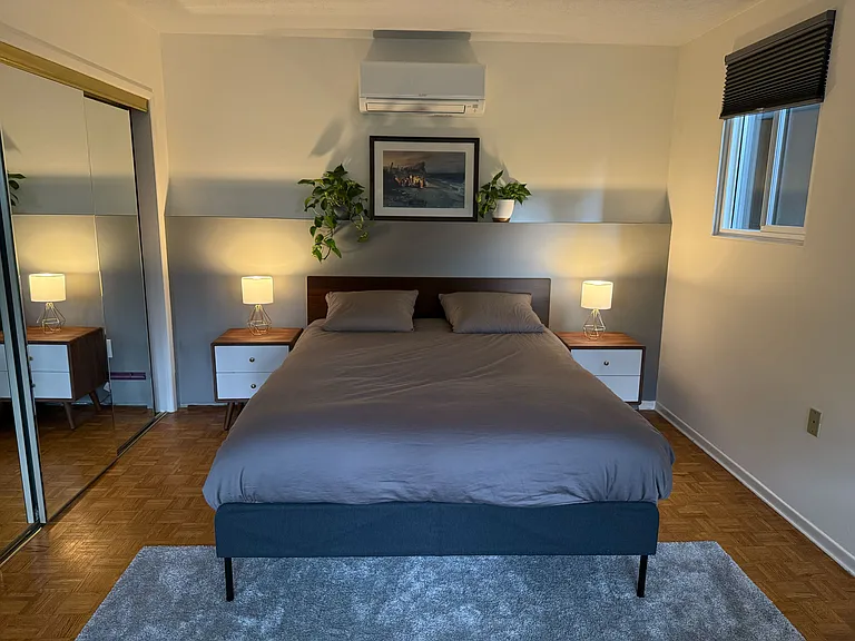 Main bedroom with mirror closet doors